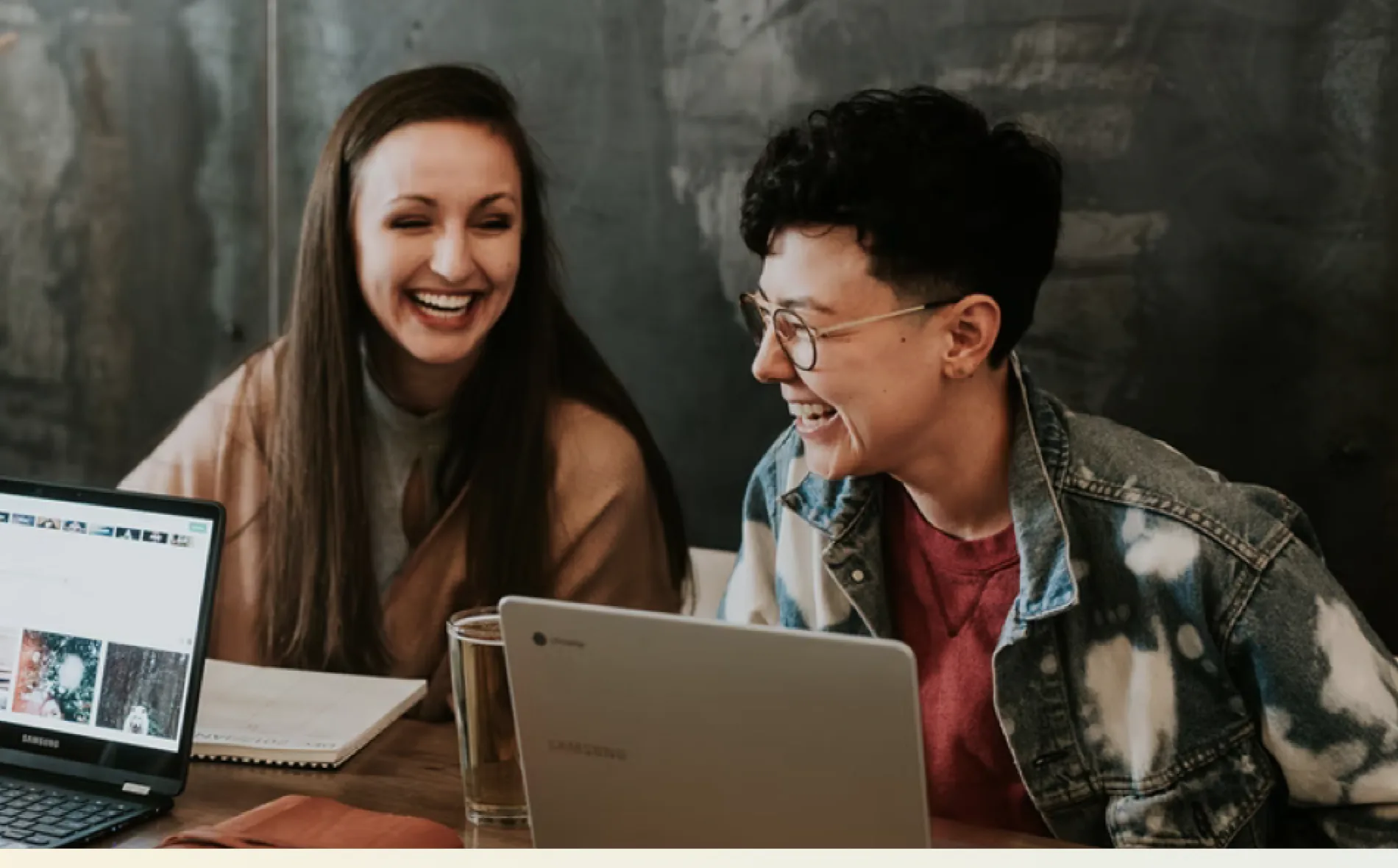 Two people collaborating at a laptop