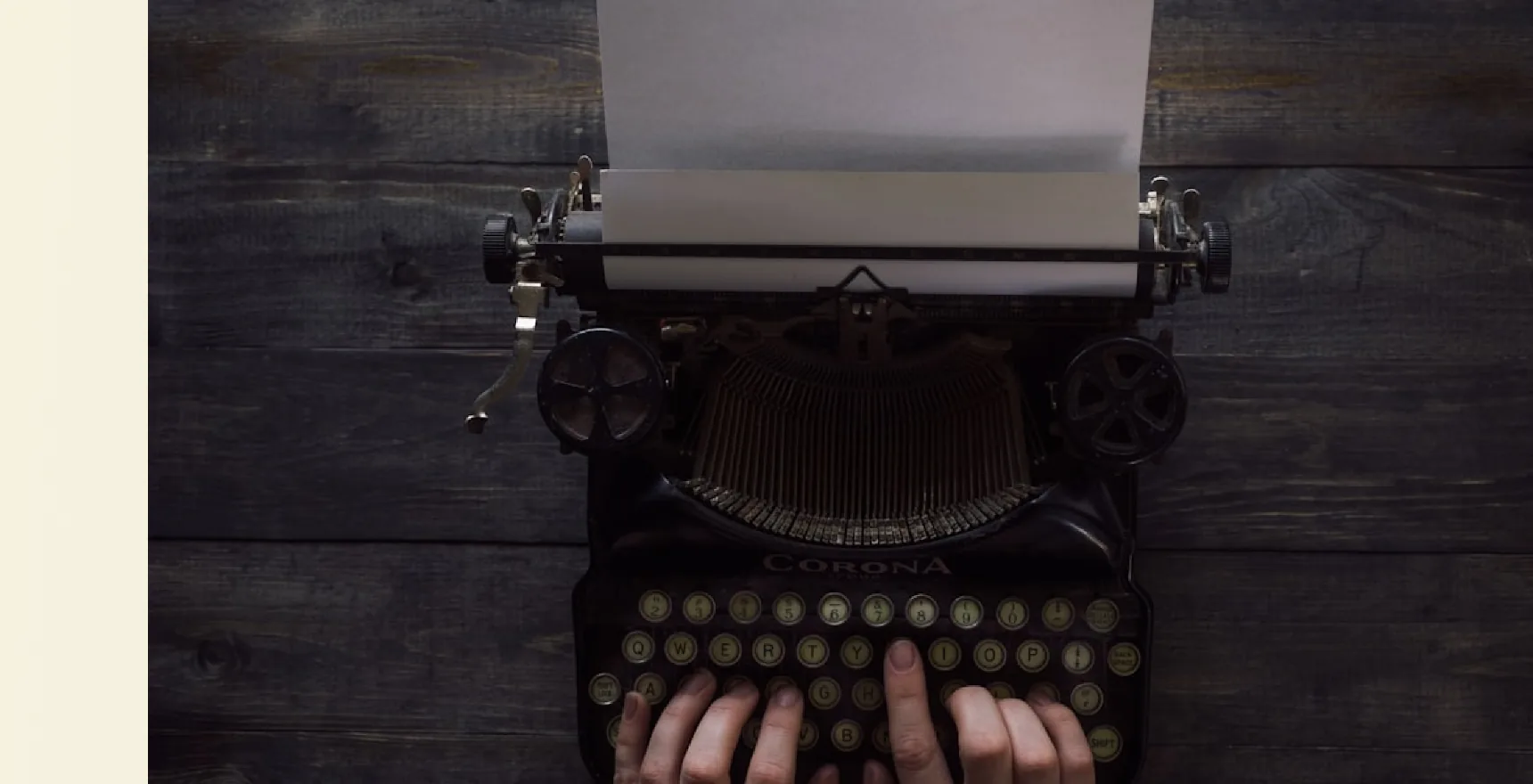 Vintage typewriter on a dark wooden desk